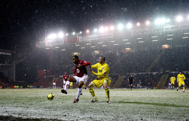 FA Cup 3rd Round: Cardiff City's Kevin McNaughton tries to tackle Bristol City's Danny Haynes