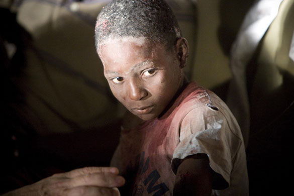 Haiti earthquake: An injured child is tended to in Port-au-Prince, Haiti 