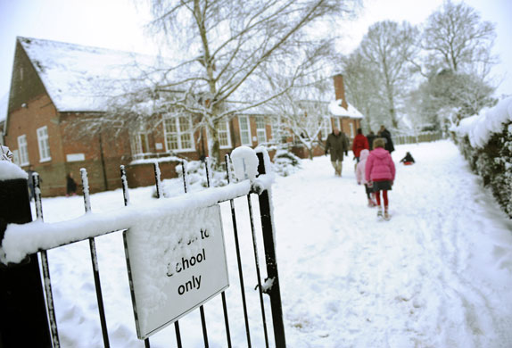 Snow again: Children make their way to class at Oakwood Infant School, Hartley Wintney