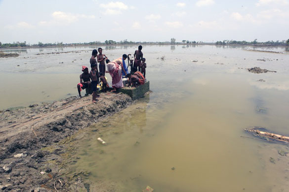 Sinking Sundarbans: Under an unbearable heat due to a delayed monsoon, villagers pump water