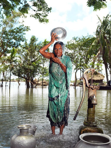 Sinking Sundarbans: a villager try to keep herself clean and fresh in Satjellia Island