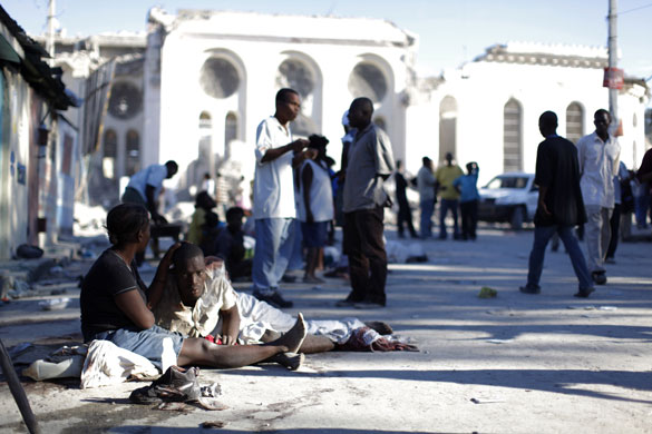 haiti update 3: Injured people rest outside Port-au-Prince's cathedral after an earthquake