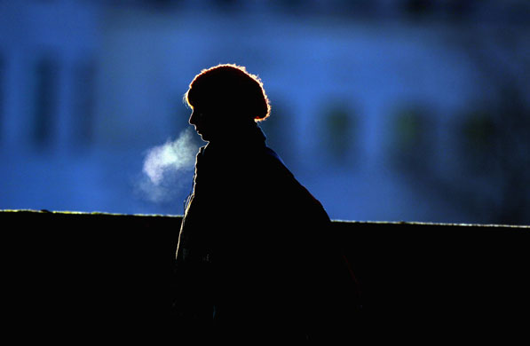 Week in Business: A woman walks to work in freezing conditions in London