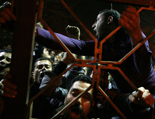 24 hours in pictures: Cairo, Egypt: Coptic Orthodox youth chant anti-government slogans