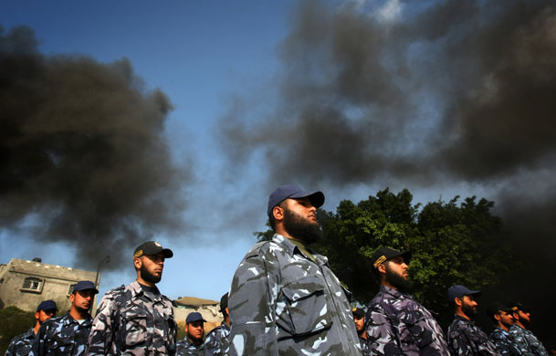 24 hours in pictures: Gaza City, Gaza: Palestinian police officers attend a graduation ceremony