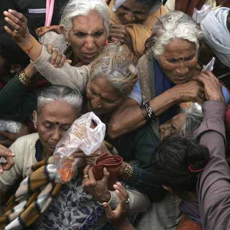 24 hours in pictures: Gangasagar, India: Pilgrims throng to make offerings at Kapil Muni temple