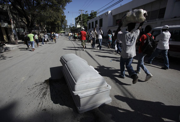 haiti quake: A coffin containing the body of an earthquake victim 