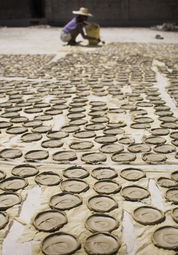 History of Haiti: 2004: Mud cakes are made in Cite Soleil, a slum in Port-Au-Prince