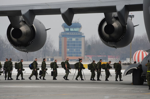 Rescue efforts in Haiti: Canadian Forces members board a C-177 Globemaster plane