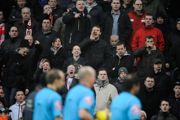 Stoke v Liverpool: Liverpool fans shout abuse at the officials as they walk off at the end