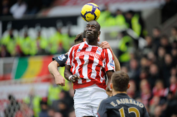 Stoke v Liverpool: Mamady Sidibe rises high to flick the ball on