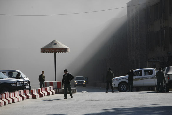 violence in kabul: Afghan security guard in front of Serena hotel