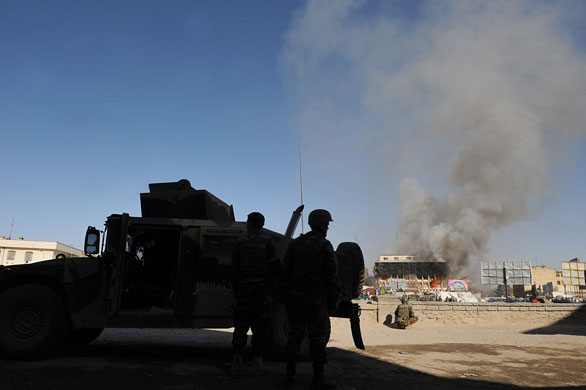 violence in kabul: Afghan National Army soldiers take cover  