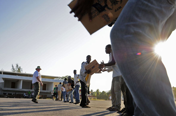 Haiti Aid: Haitian citizens unload supplies