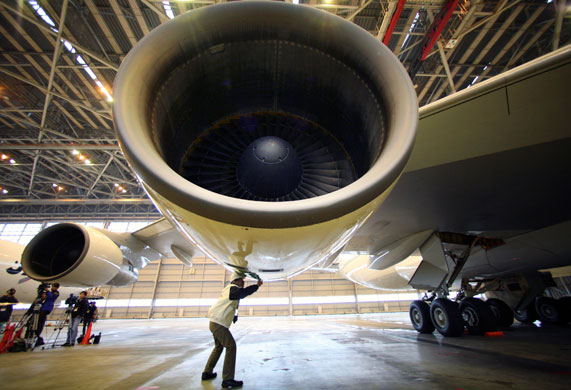 Japan Airlines: January 2009: A member of Japan Airlines staff checks an engine