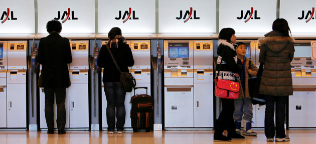 Japan Airlines: January 2010: Passengers at Japan Airlines check in at Handea Airport