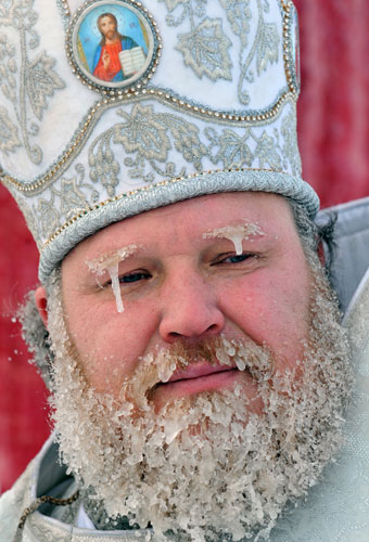 Orthodox Epiphany : An Orthodox priest with icy beard and eyebrows