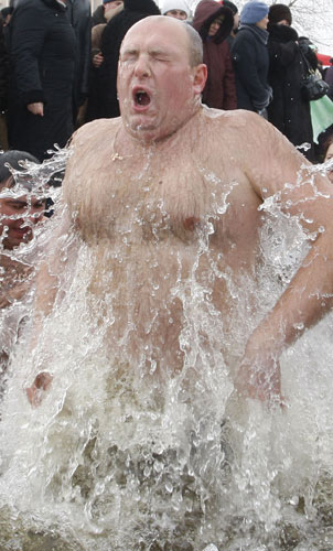 Orthodox Epiphany : Ukrainians reacts after a dip in an icy pond