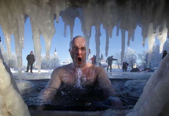 Epiphany: A Russian Orthodox believer swims in an ice hole 