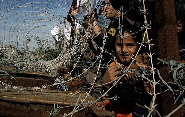 24 Hours: Palestinian youths take part in a demo against Egypt's border barrier