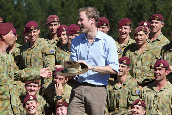 Prince William down under: Prince William holds a Slouch hat given to him by soldiers