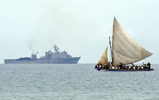 haiti aftermath: A Haitian boat sails off the coast of Bonel