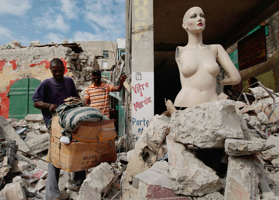 haiti aftermath: People salvage items from the rubble in Port-au Prince, Haiti