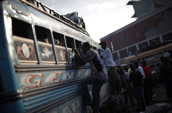 haiti aftermath: Residents leave Port-au-Prince by a bus second earthquake 