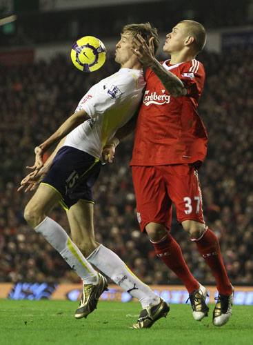 Wednesday Football: Peter Crouch controls the ball despite the close attention of Martin Skrtel
