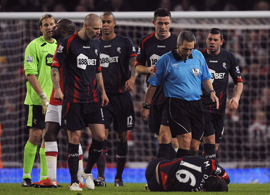 Wednesday Football: Mark Davies lies injured after being tackled by Gallas