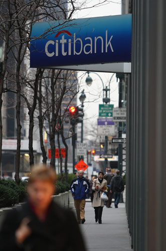 Week in Business: A person walks past a Citibank branch in Manhattan
