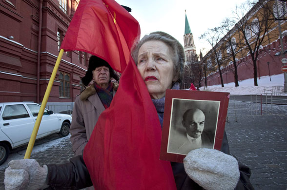 24 hours in pictures: Moscow, Russia: Communist supporters wait to visit the mausoleum of Lenin
