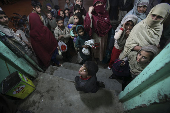 24 hours in pictures: Rawalpindi, Pakistan: People line up to receive a meat sandwich