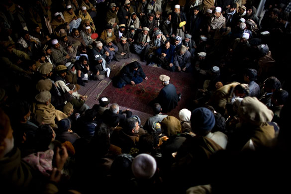 24 hours in pictures: Kabul, Afghanistan: People watch small birds fight