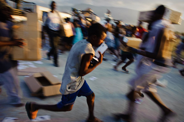 Haiti: Haitians fighting for aid at an airfield in Port-au-Prince