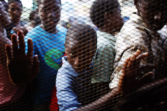 Haiti: People wait to get free meals from a local restaurant in Port-au-Prince 