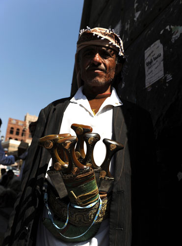 Yemen : A trader sells traditional daggers called Jambia in the Old City of Sana'a 