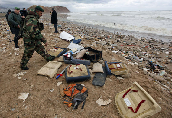 beirut crash: Lebanese soldiers gather debris from the shore near Beirut airport 