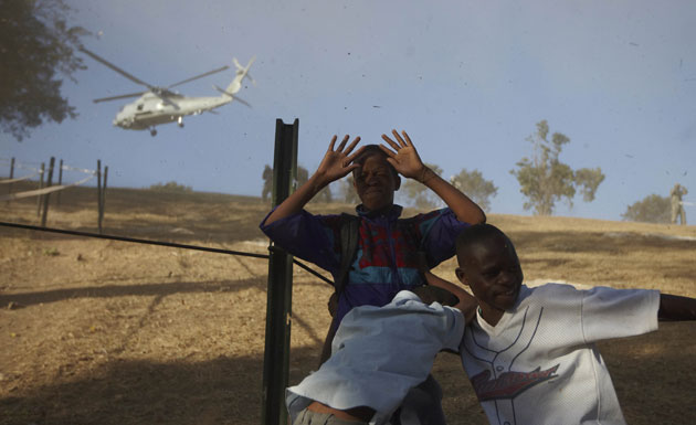 Camps in Haiti: U.S. military helicopter lands at a refugee camp in Haiti