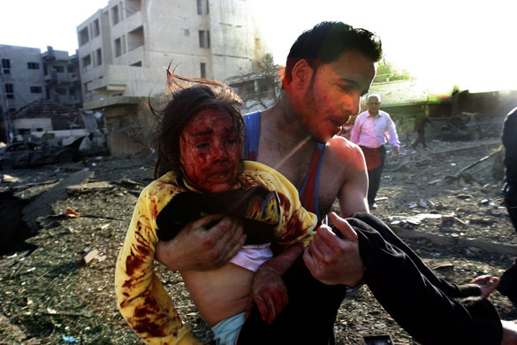 bombs in  baghadad: Suicide car bomb attack outside the Alhamraa hotel in Baghdad