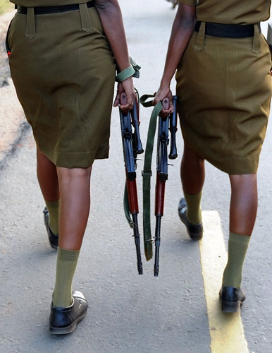 24 hours in pictures: Vavuniya, Sri Lanka: Policewomen with automatic weapons patrol the streets 