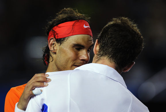 Murray v Nadal Qtr Final: Murray and Nadal embrace after Nadal retires from their match