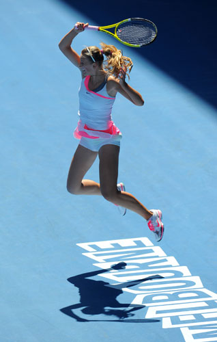 Aus Open Day 10: Victoria Azarenka leaps as she plays a forehand return