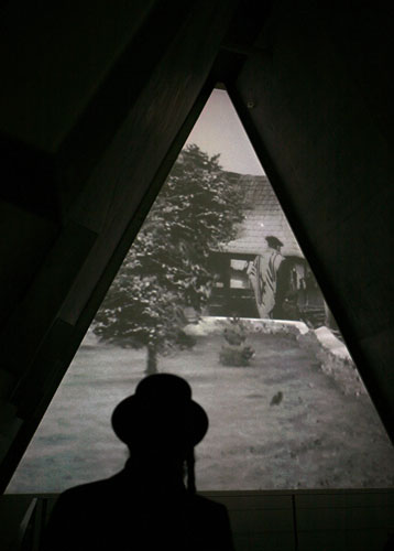 24 hours : A visitor walks past a video installation at Yad Vashem