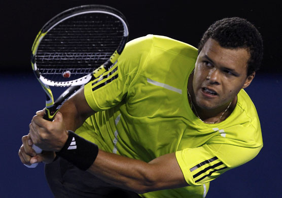 tennis: Tsonga returns a shot against Djokovic