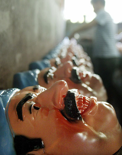 2003 Three Months to war: Plastic masks with a likeness of Iraqi President Saddam Hussein