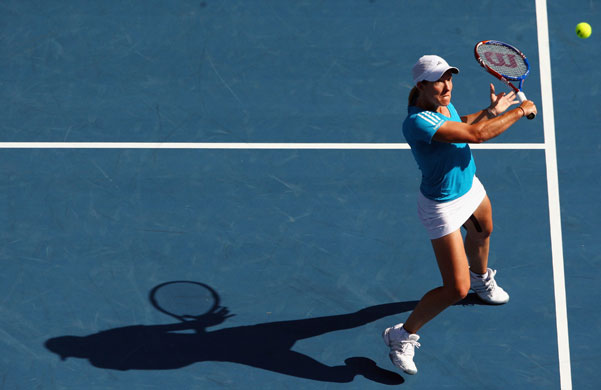 Aus Open day 11: Henin plays a backhand return