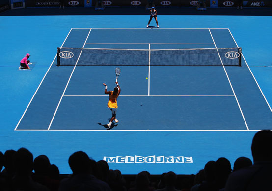 Aus Open day 11: Serena Williams plays a forehand return to Na Li