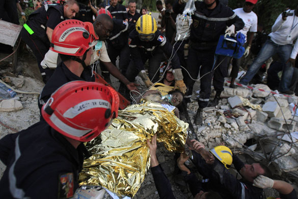 Haiti's survivors: 27 January: A Haitian girl is rescued by a French team