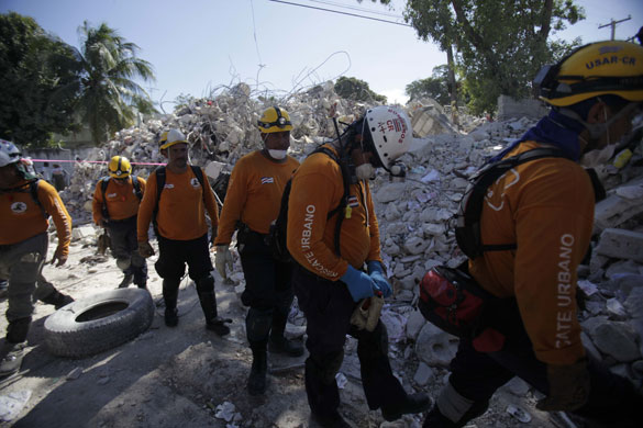 Haiti's survivors: 21 January: A rescue team from Costa Rica leaves a site